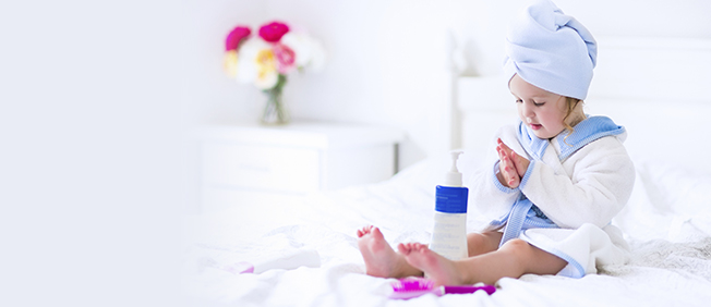 Little girl with bathrobe and towel around her head